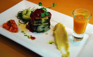 Layered spinach and potato, with beetroot and tomato sauce